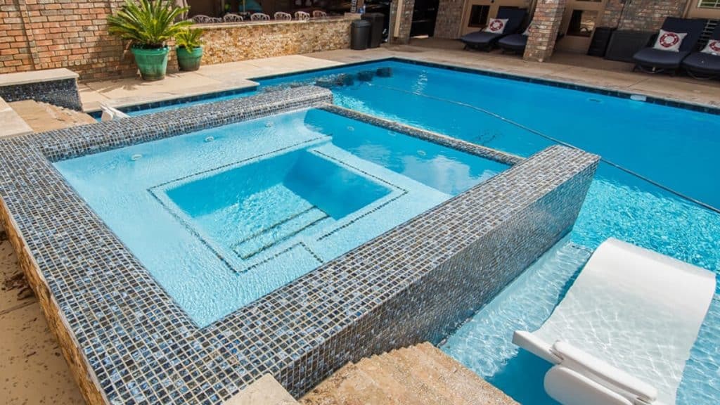 Innovative Pool Finishes: From Tiles to Modern Materials Swimming pools are more than just a place to cool off during hot summer days; they are a central feature of our homes, a source of beauty, relaxation, and entertainment. As such, choosing the right pool finish can greatly enhance the aesthetic appeal and functionality of your pool. In recent years, there has been a significant evolution in pool finishes, moving from traditional tiles to an array of modern materials. This blog post will delve into these options, emphasizing the newest trends and materials in pool finishes, ideal for those considering pool restoration Sydney or building a new pool. The Time-Honored Appeal of Tile Finishes Tiles have been a mainstay in pool finishes for decades. Their timeless appeal lies in their durability, variety, and aesthetic flexibility. Ceramic and porcelain tiles are commonly used, known for their resistance to pool chemicals and wear. The variety in colors, sizes, and designs allows for significant customization. Among these, mosaic tiles stand out, offering the ability to create detailed, vibrant designs that can turn any pool into a work of art. The Luxurious Touch of Glass Tiles Building upon the foundation laid by ceramic and porcelain, glass tiles represent a more luxurious and contemporary choice. Their ability to reflect light creates a captivating sparkle, enhancing the visual appeal of the pool. Glass tiles are not only beautiful but also practical, being water, stain, and chemical-resistant. They come in various colors and designs, enabling pool owners to make a statement, whether they prefer understated elegance or bold designs. Pebble Finishes: Merging Durability with Natural Beauty Pebble finishes have gained popularity for those who prefer a natural and organic look. Comprising small, smooth pebbles set in plaster, these finishes offer a unique texture and appearance that resembles a natural lagoon. Apart from their aesthetic appeal, pebble finishes are known for their durability and longevity, making them an excellent long-term investment. Aggregate Finishes: Where Endurance Meets Elegance Aggregate finishes, a blend of plaster with materials like quartz, glass beads, or granite, offer a fantastic combination of durability and beauty. They are especially suited for frequently used pools due to their resistance to staining and wear. The materials used in aggregate finishes lend a shimmering effect to the pool surface, with a variety of colors and textures available for customization. Eco-Friendly Options: Sustainable and Stylish In the era of environmental consciousness, eco-friendly pool finishes have emerged as a popular choice. These finishes, which use sustainable materials and processes, include options like recycled glass tiles and natural stone. They offer a way to be stylish and environmentally responsible simultaneously. The Rise of Advanced Technological Finishes Technological advancements have introduced innovative materials for pool finishes. Polymer-based finishes, for example, offer enhanced durability and resistance to fading and chemical damage. These materials are easier to maintain, appealing to homeowners who prefer a low-maintenance option. Personalization at Its Best Modern pool finishes offer extensive customization and personalization options. Homeowners can choose finishes that align with their home’s architecture and their personal style. From custom designs and patterns to unique color combinations, the possibilities are endless for creating a pool that reflects the owner’s taste and personality. Maintenance Considerations An essential aspect to consider when choosing a pool finish is its maintenance requirements. Some finishes demand more upkeep than others. Tile finishes, for example, may need periodic re-grouting, while pebble finishes are known for their low maintenance. The chosen finish will significantly impact the long-term care and associated costs of maintaining the pool. Pool Restoration in Sydney: A Revival Opportunity For Sydney residents looking to rejuvenate their aging pools, pool restoration services offer a chance to upgrade to these modern finishes. Pool restoration can transform an old pool into a contemporary, stylish, and efficient backyard feature, enhancing both its function and beauty. Beyond the Surface: Additional Considerations for Pool Finishes When selecting a pool finish, it's also important to consider factors such as the pool’s overall design, the surrounding landscape, and the climate. For instance, darker finishes can absorb more heat, which might be beneficial in cooler climates but less so in warmer regions. Similarly, the finish should complement the pool’s shape and design, ensuring a cohesive look. Custom Features and Finishes In addition to the pool finish, custom features such as waterfalls, fountains, or integrated spa areas can add a distinctive touch. Incorporating these features requires careful planning and design to ensure they blend seamlessly with the chosen finish. Safety and Slip Resistance Safety is another crucial aspect. Certain finishes offer better slip resistance than others, which is particularly important in family pools or areas frequently used by children and the elderly. Long-Term Value and Investment Investing in a high-quality pool finish can also increase the value of your property. A well-maintained, aesthetically pleasing pool is a significant selling point for any home. A World of Choices for Every Pool Owner The options for pool finishes today are vast and varied, catering to every style, preference, and budget. Whether you are embarking on a new pool project or considering pool restoration, there is a finish that can transform your pool into a captivating backyard centerpiece. From the classic charm of tiles to the cutting-edge appeal of modern materials, the right pool finish can elevate your swimming pool from a mere water feature to a stunning focal point of your home.