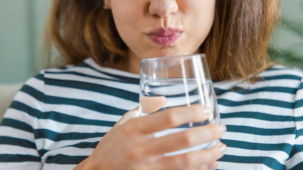 Person doing Oil Pulling