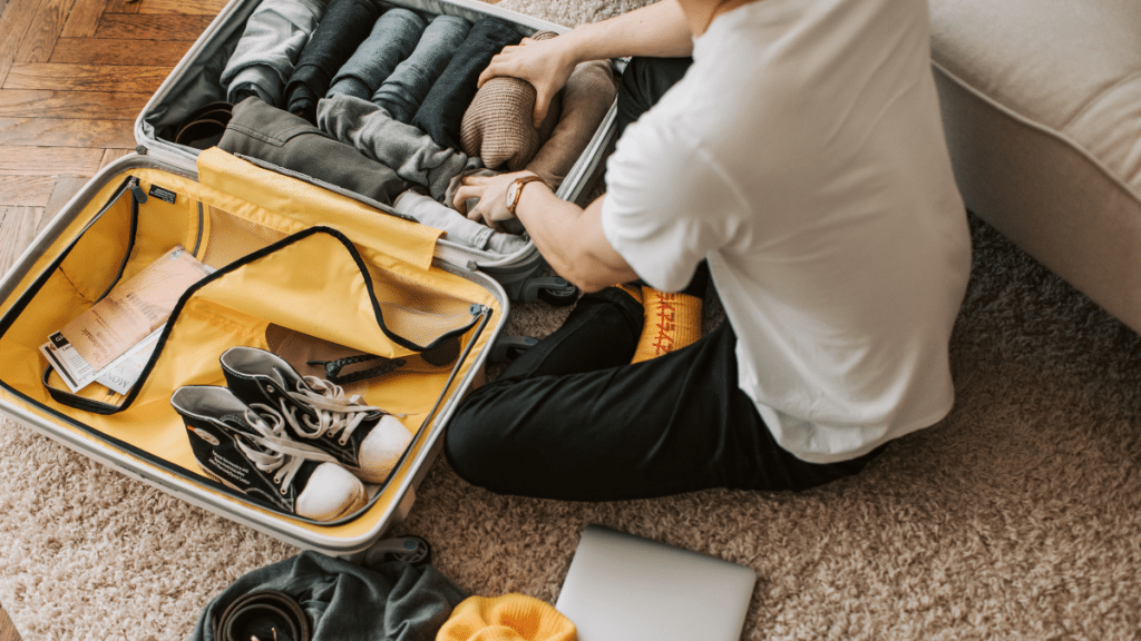 A person packing in a neatly organized room, illustrating efficient packing techniques for a local move.