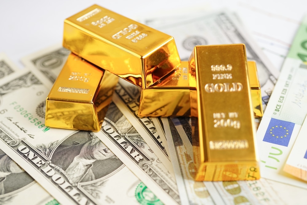 Gold IRA Rollover Rules: What Investors Need To Know Stacks of gold bars and retirement account documents representing Gold IRA rollover rules