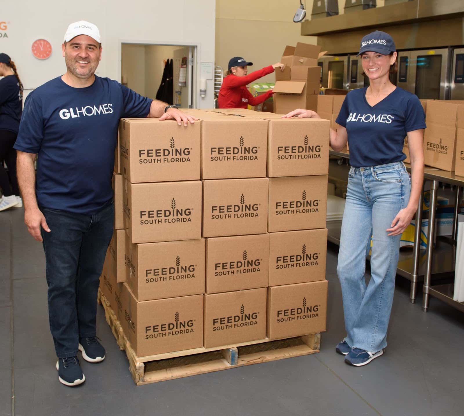 Misha Ezratti and his wife, Jessica Ezratti volunteer at Feeding South Florida.