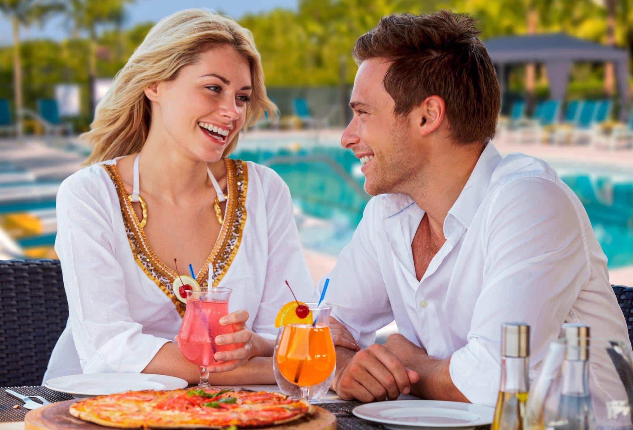 GL Homes residents enjoying a meal poolside built under the direction of Itchko Ezratti.