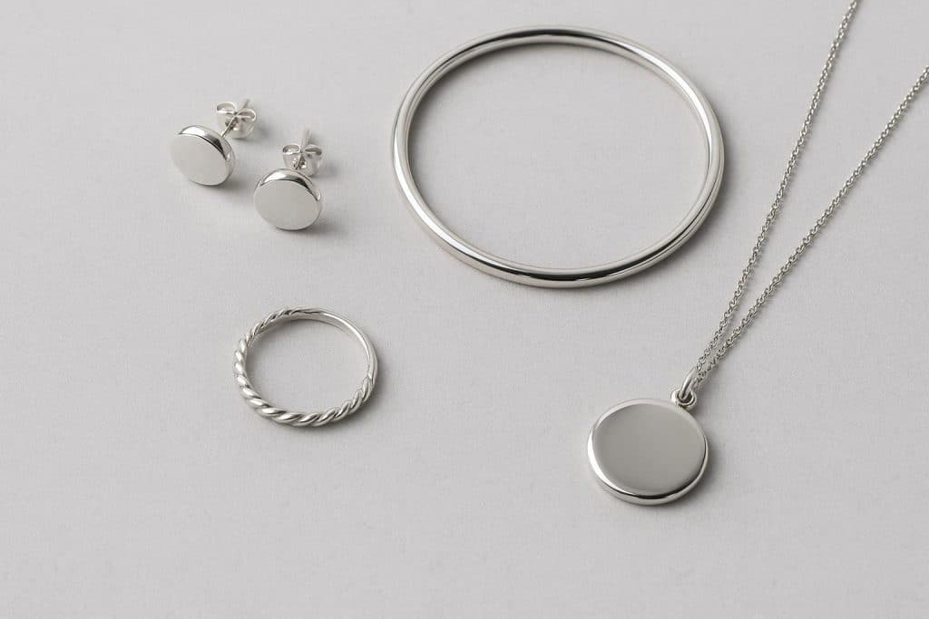 Elegant silver jewellery pieces displayed on a velvet tray, highlighting timeless fashion style